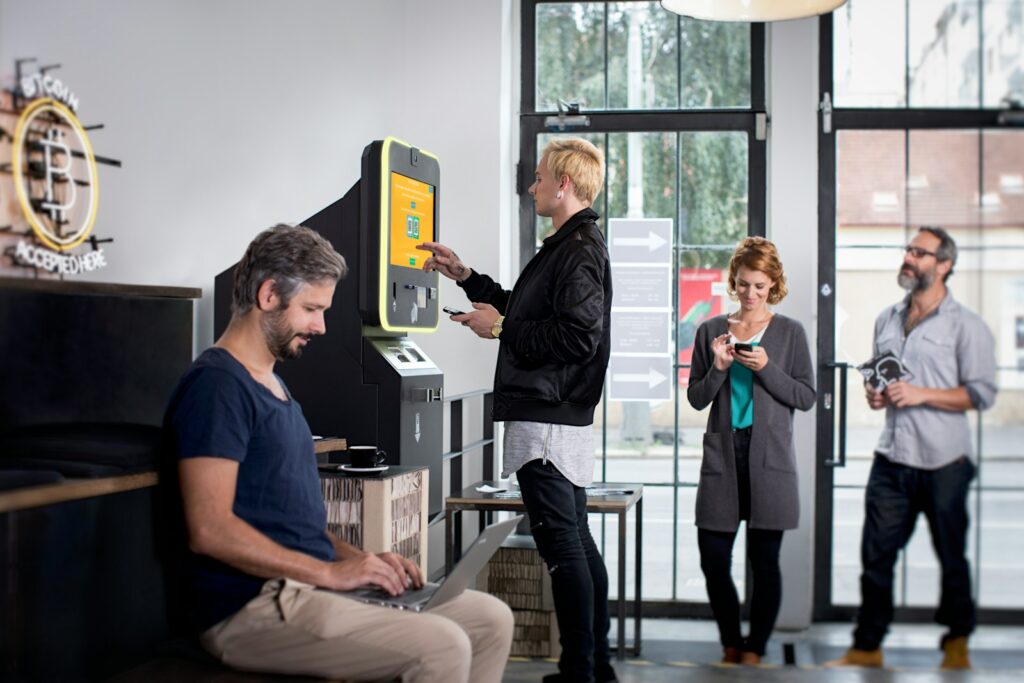 a group of people standing around a machine