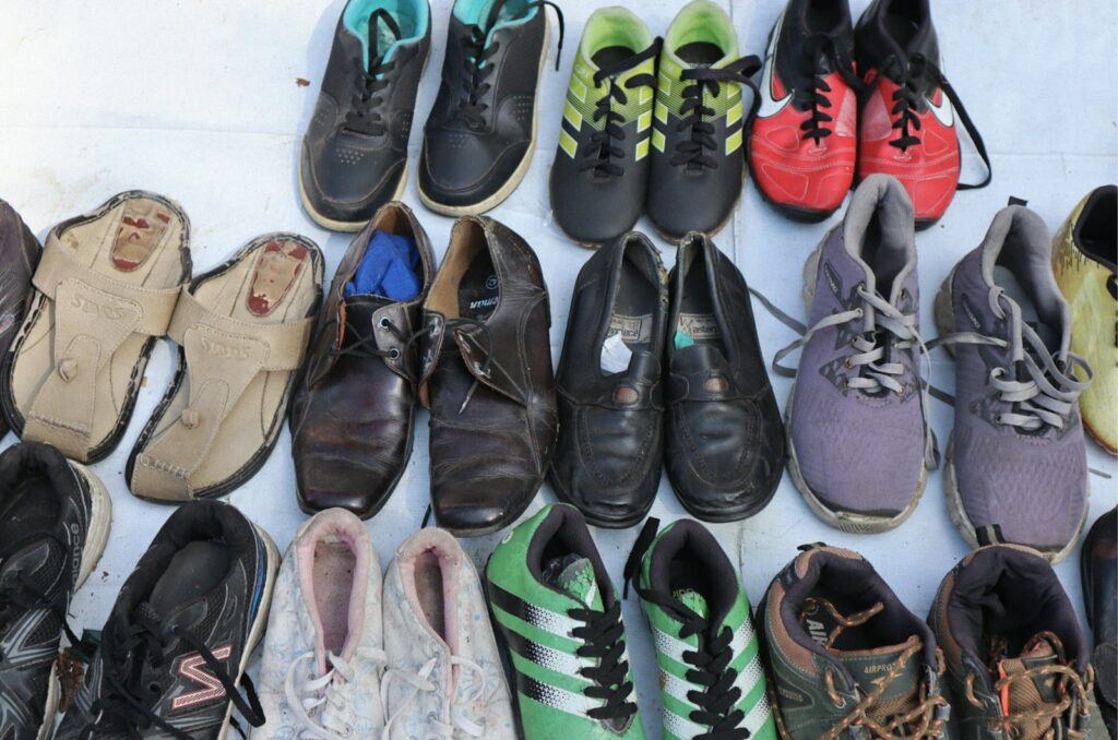 A bunch of shoes that are lined up together
