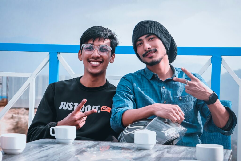 man in black crew neck shirt beside woman in blue denim jacket