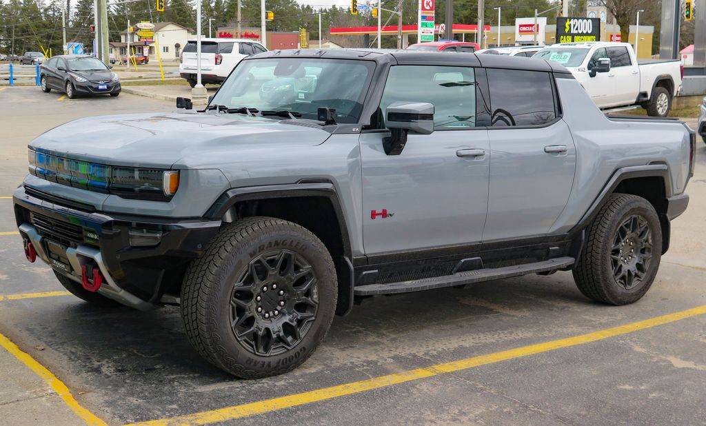 2024 GMC Hummer EV Pickup 2X 4WD Sport Package in Meteorite Metallic, front left, 2024-03-31