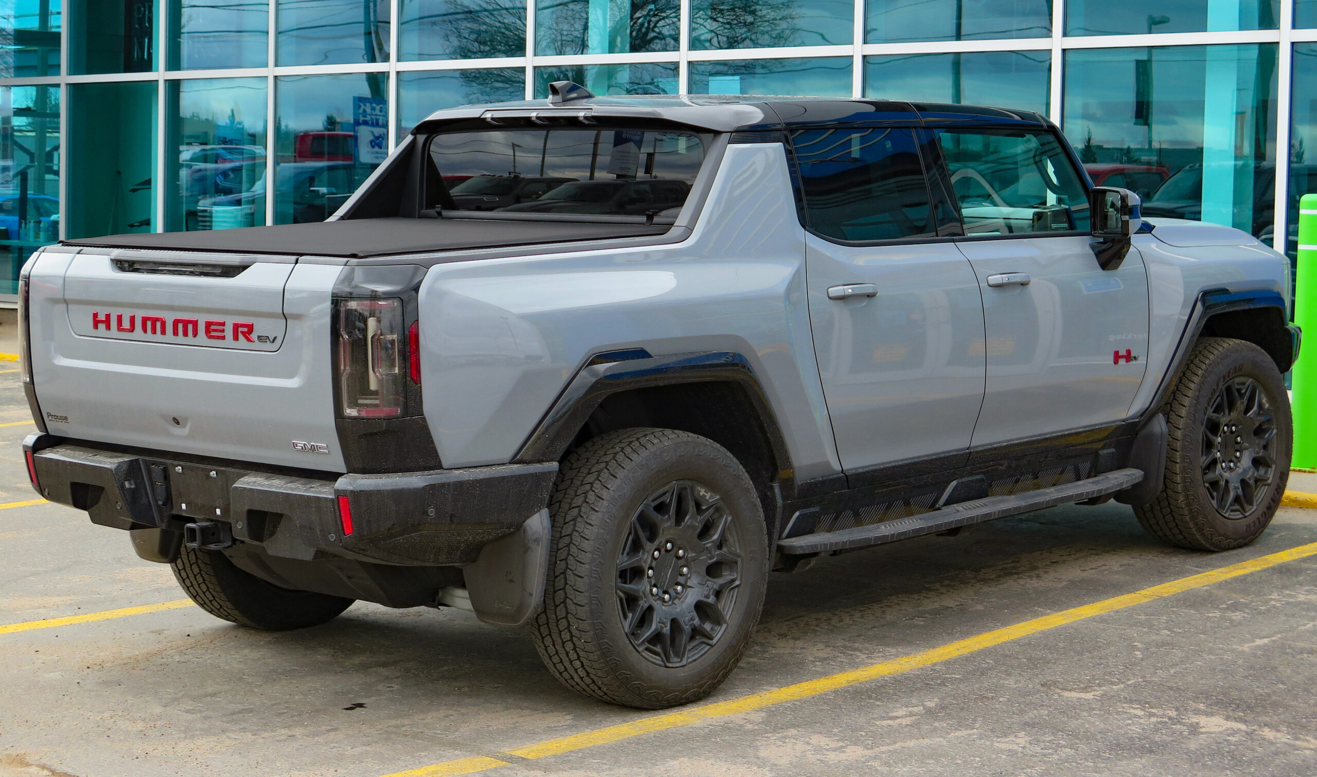 2024 GMC Hummer EV Pickup 2X 4WD Sport Package in Meteorite Metallic, rear right, 2024-03-31