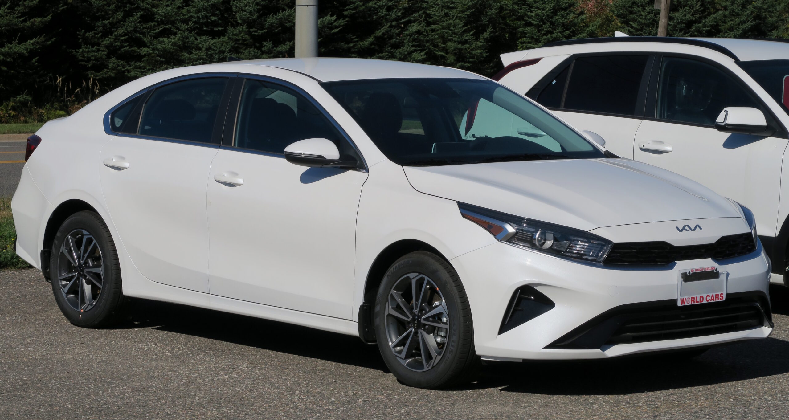 2024 Kia Forte EX in Snow White Pearl, front right, 2024-09-29