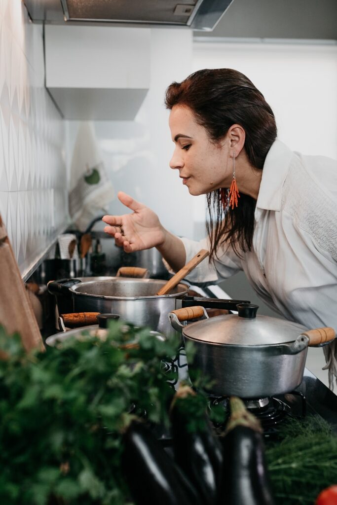 woman in white robe holding chopsticks