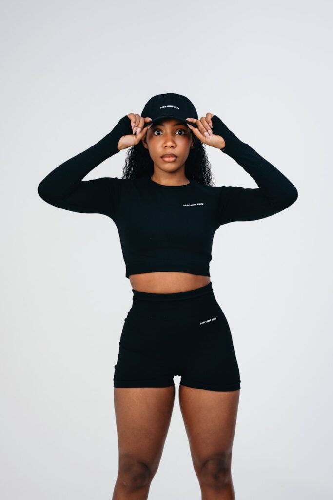 A woman in a black top and shorts