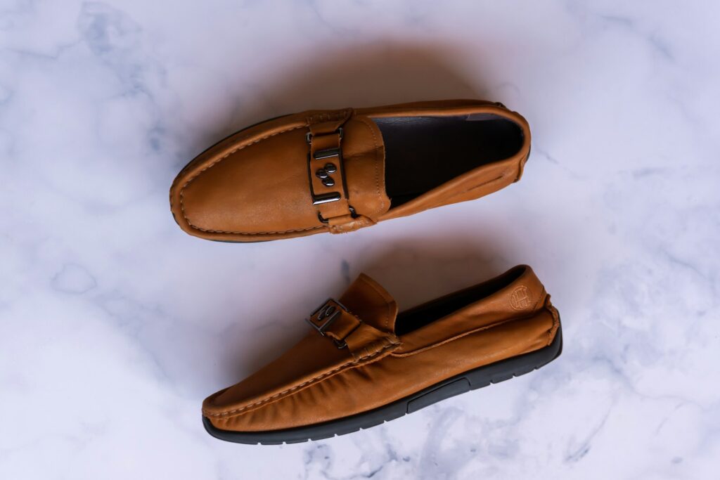 a pair of brown leather shoes