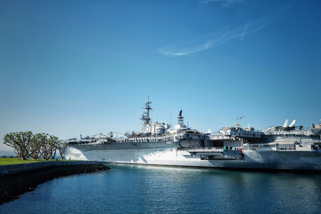 white ship on sea under blue sky during daytime