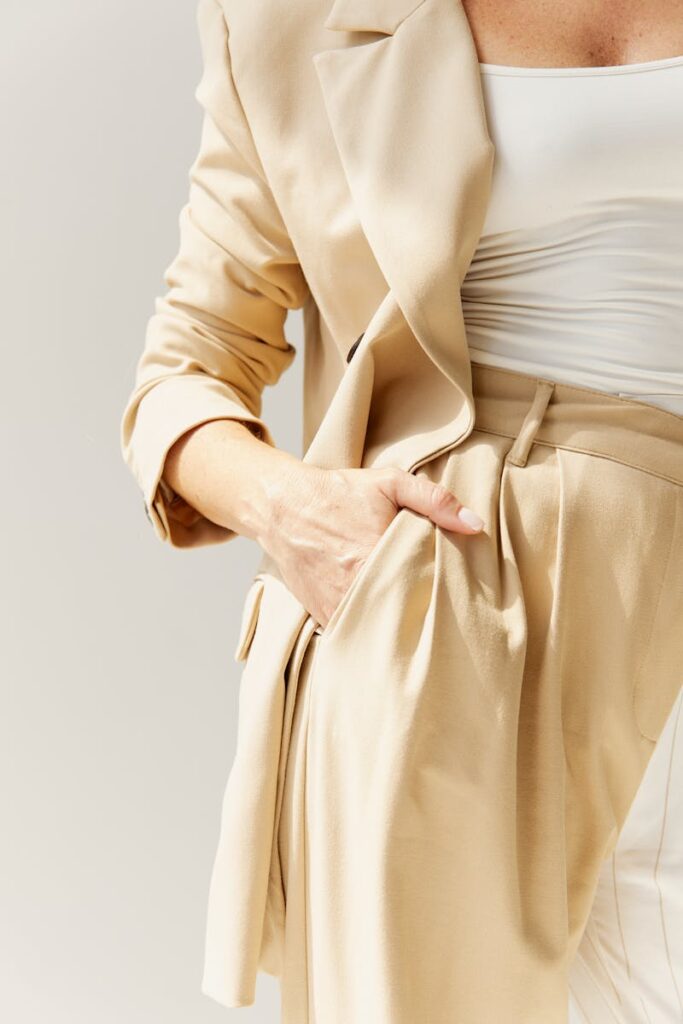 Close-up of a fashionable beige blazer and pants, showcasing modern elegance.