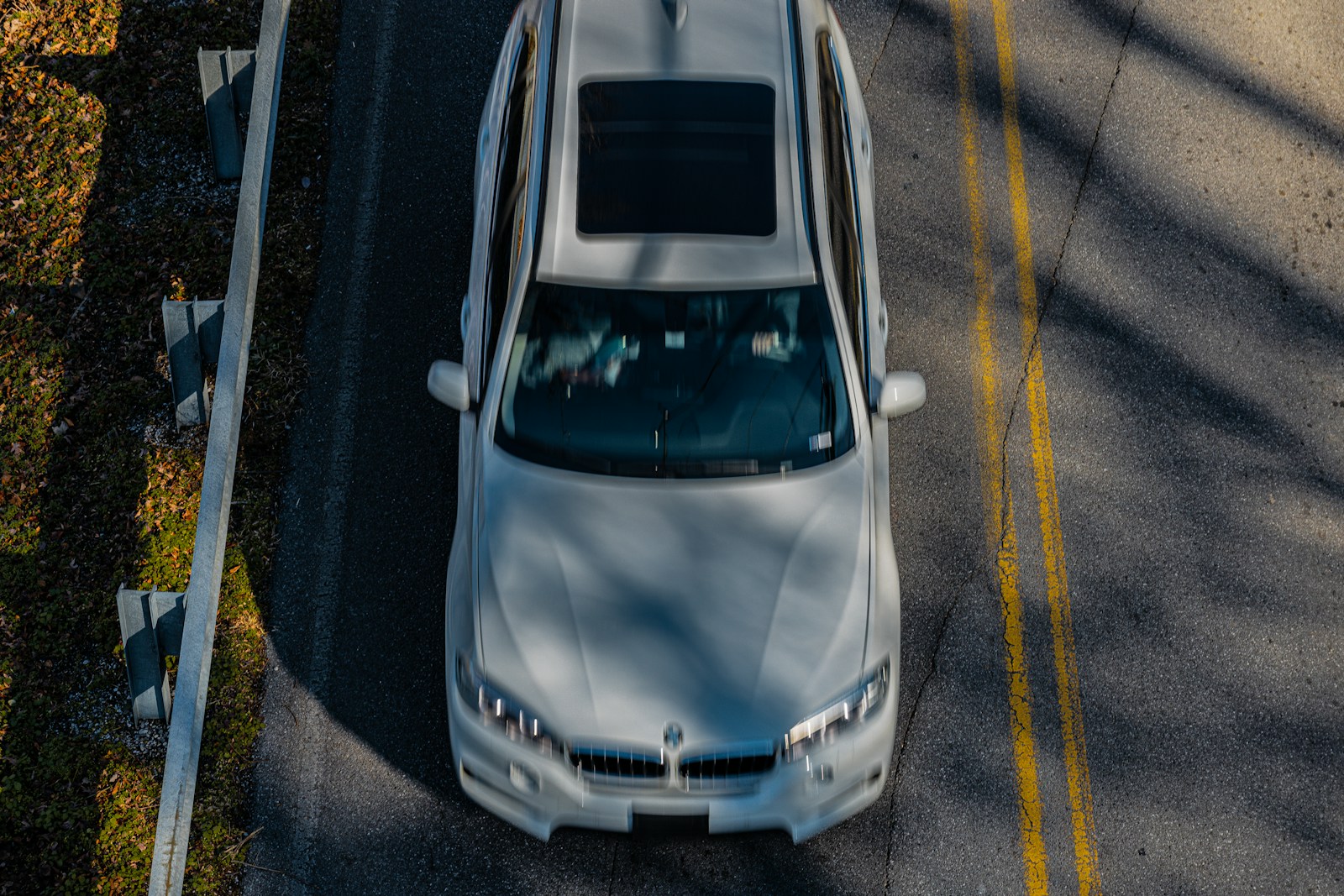 a white car parked on the side of the road