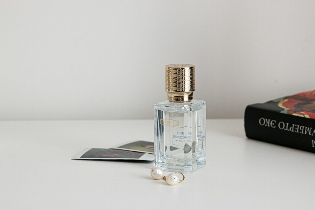 clear glass bottle with silver lid