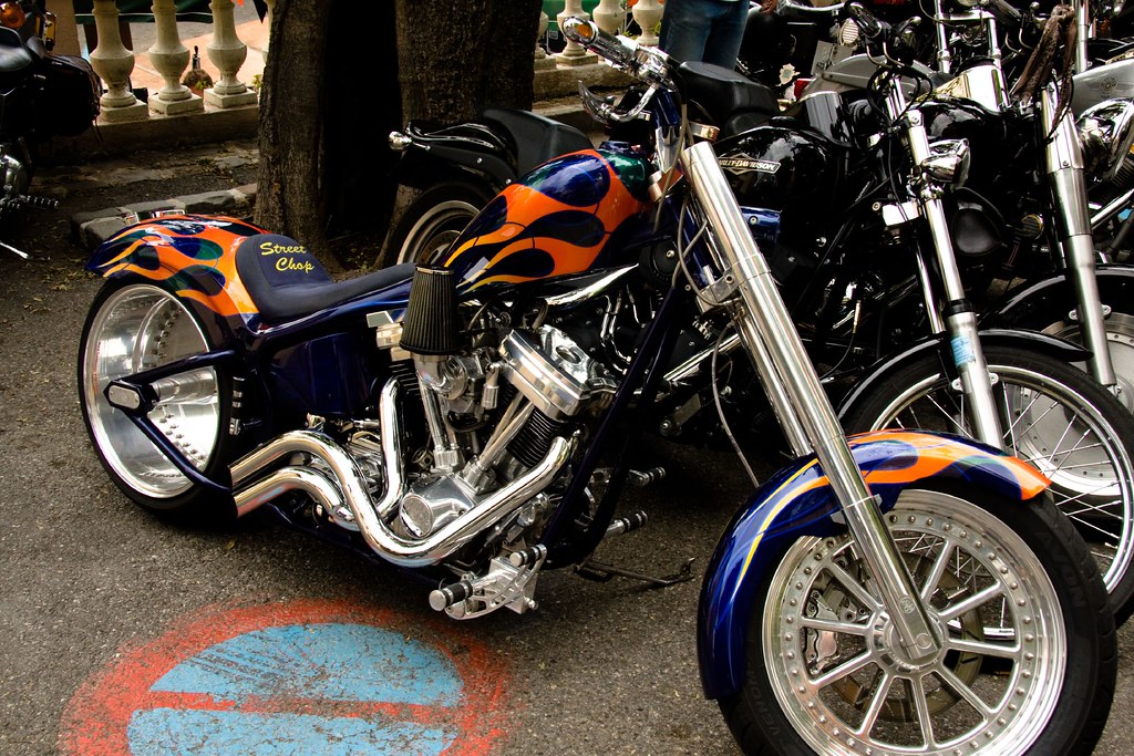 Blue and orange custom painted Harley Davidson in Grimaud