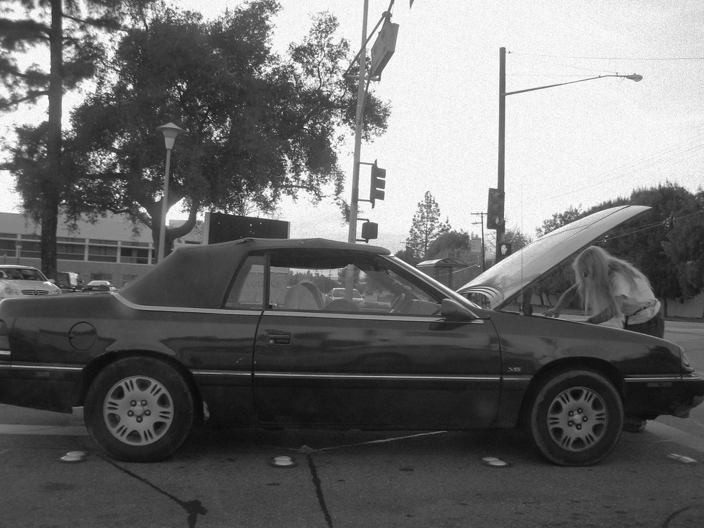 Car-fixing-white-haired Hippie Man