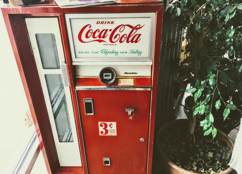 Classic Coca-Cola vending machine showcasing retro style and nostalgic vibes.