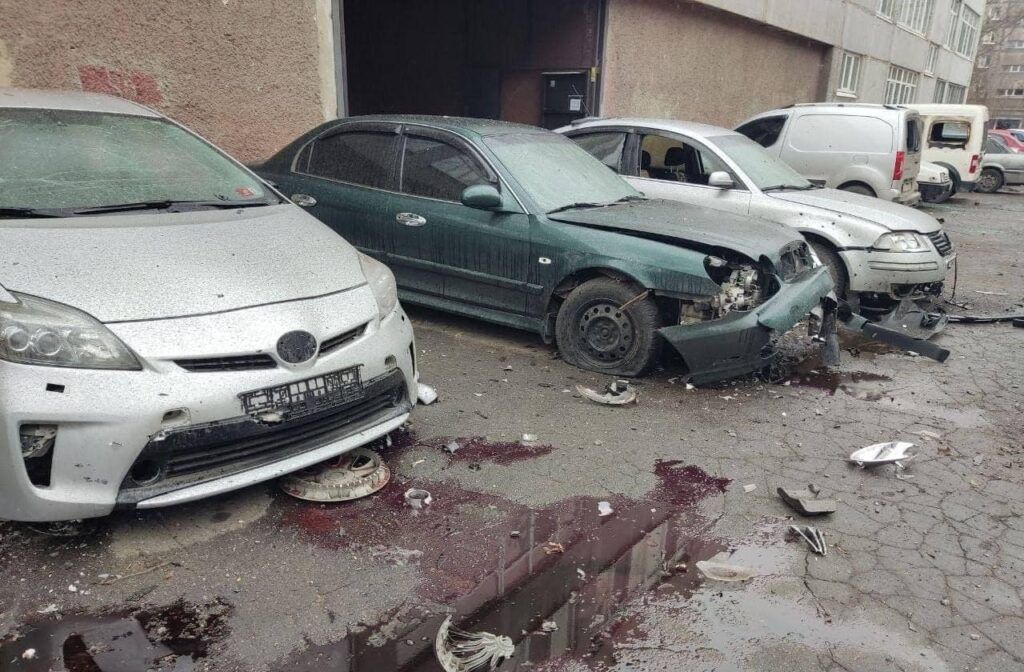 Damaged cars leaking transmission fluid following the battle of Mariupol