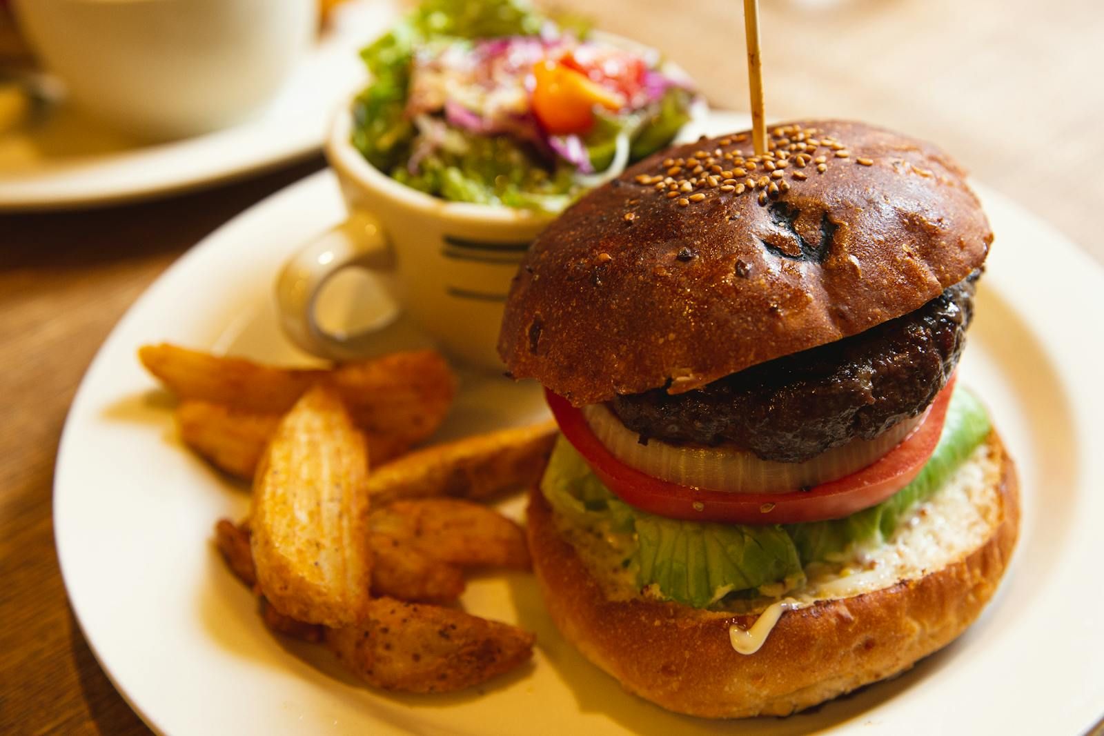 Experience Southern Comfort: Juicy Ground Chuck Burger with Homemade Bun and Crispy Fried Okra
