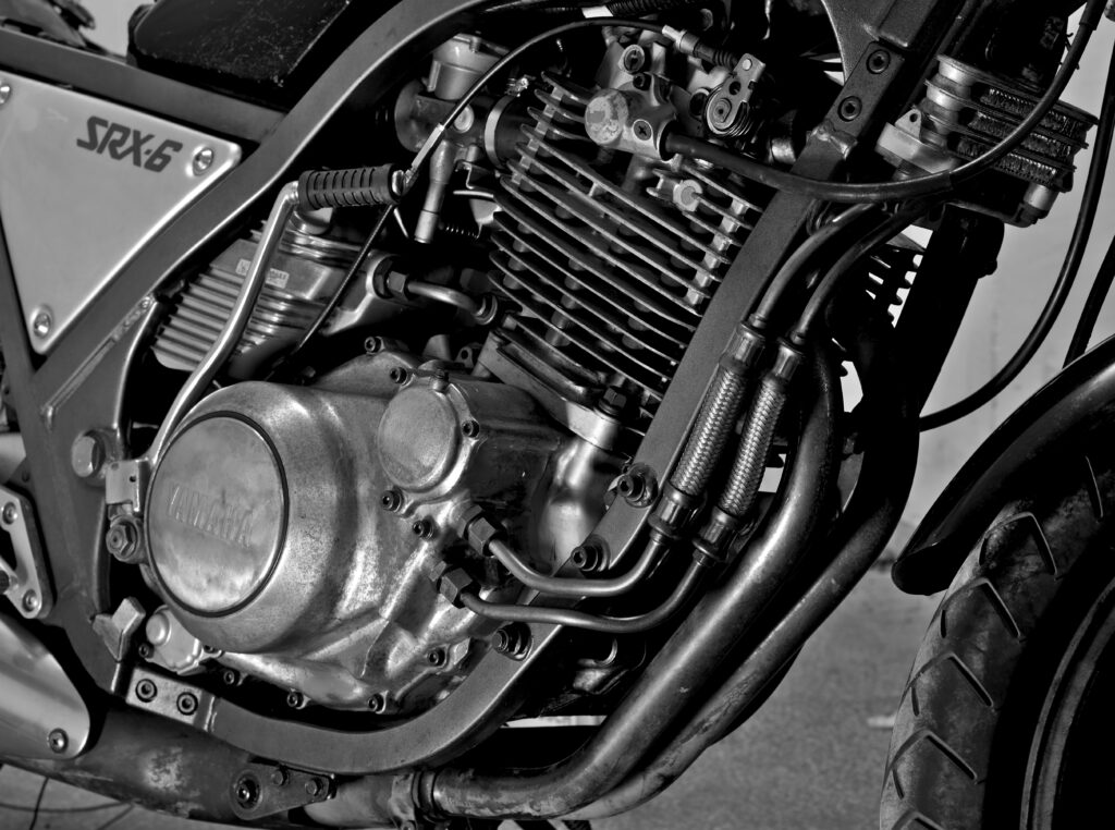 Detail view of a large single-cylinder air-cooled motorcycle engine