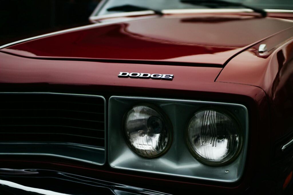 Detailed close-up of a vintage Dodge car front with chrome headlights in Curitiba, Brazil.