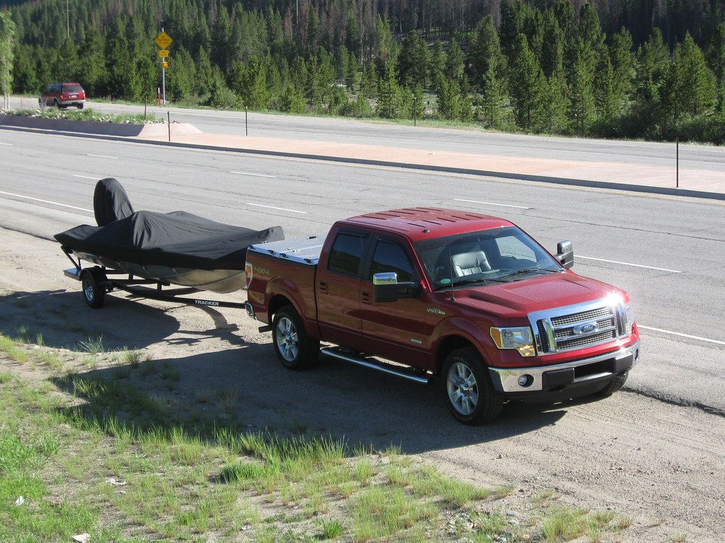 F-150 with Diamond Plate Bed Cover Pulls Boat Trailer