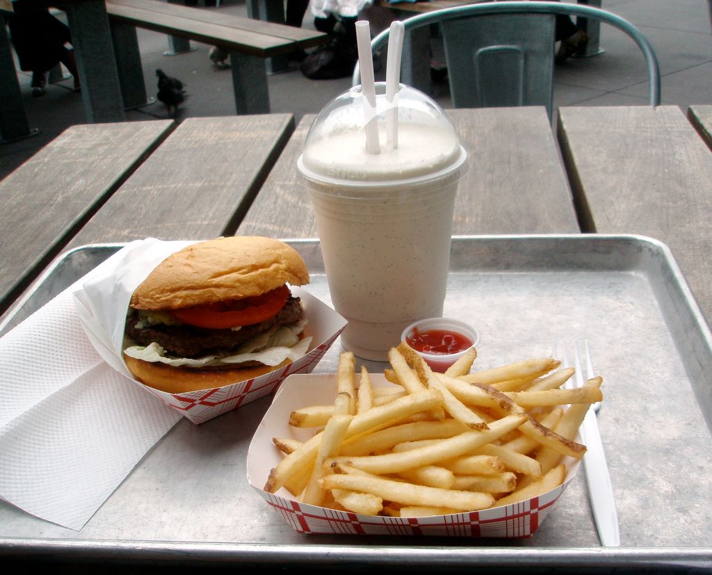 dipping French fries into a milkshake