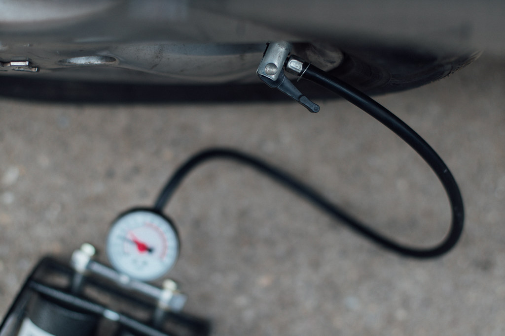Inflating a car tire with an air pump