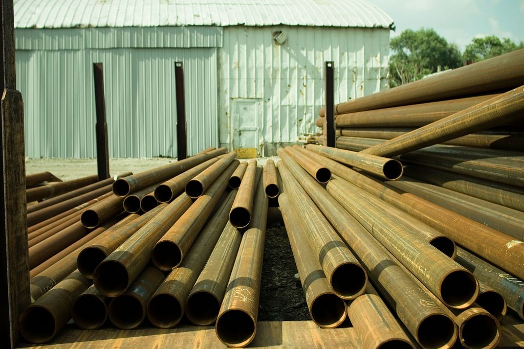 Metal tubes stored in a yard