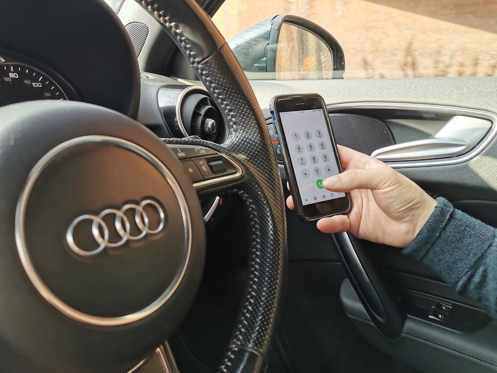 Using a mobile phone while driving stock photo