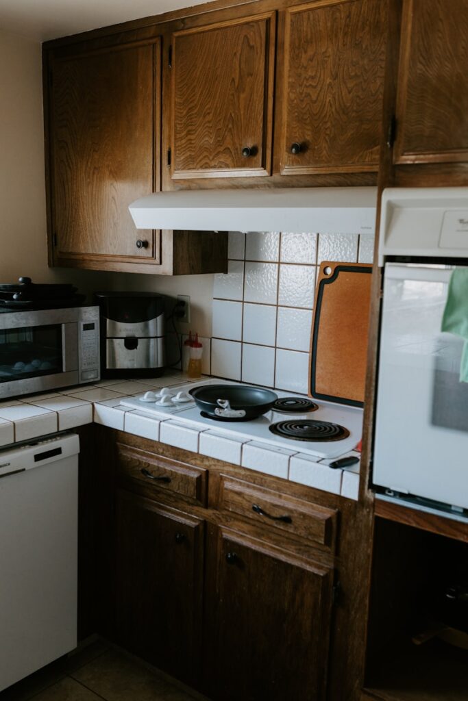 a kitchen with a stove, microwave, and dishwasher