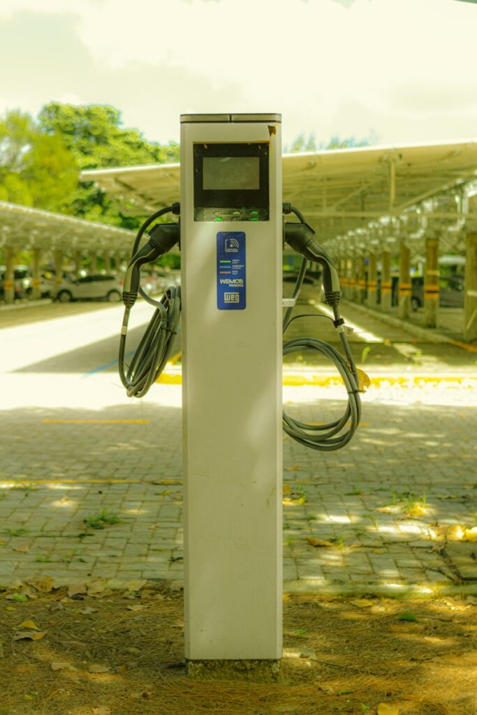 a parking meter sitting on the side of a road