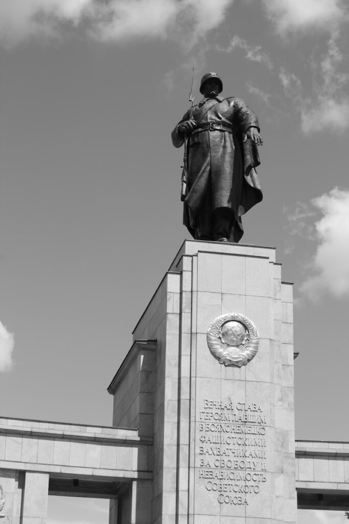 Monument to soviet soldiers with text.