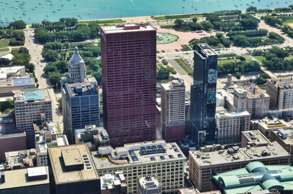 an aerial view of a city with tall buildings