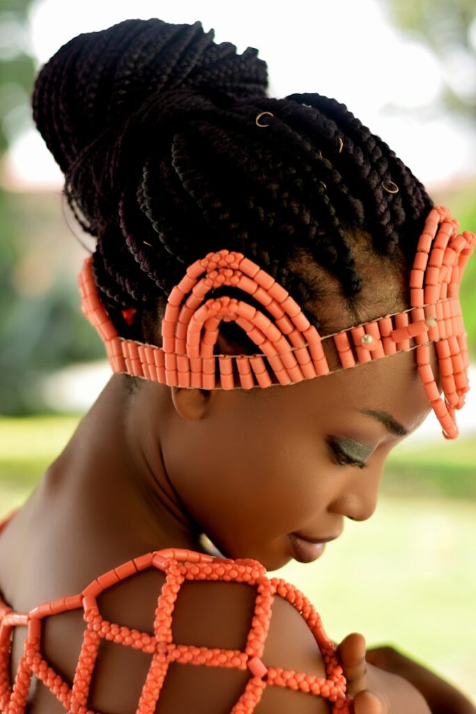 child in orange and black knit cap