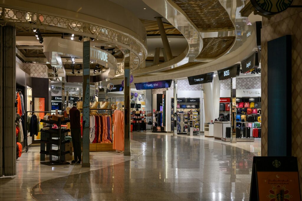 A bright and modern shopping mall interior.