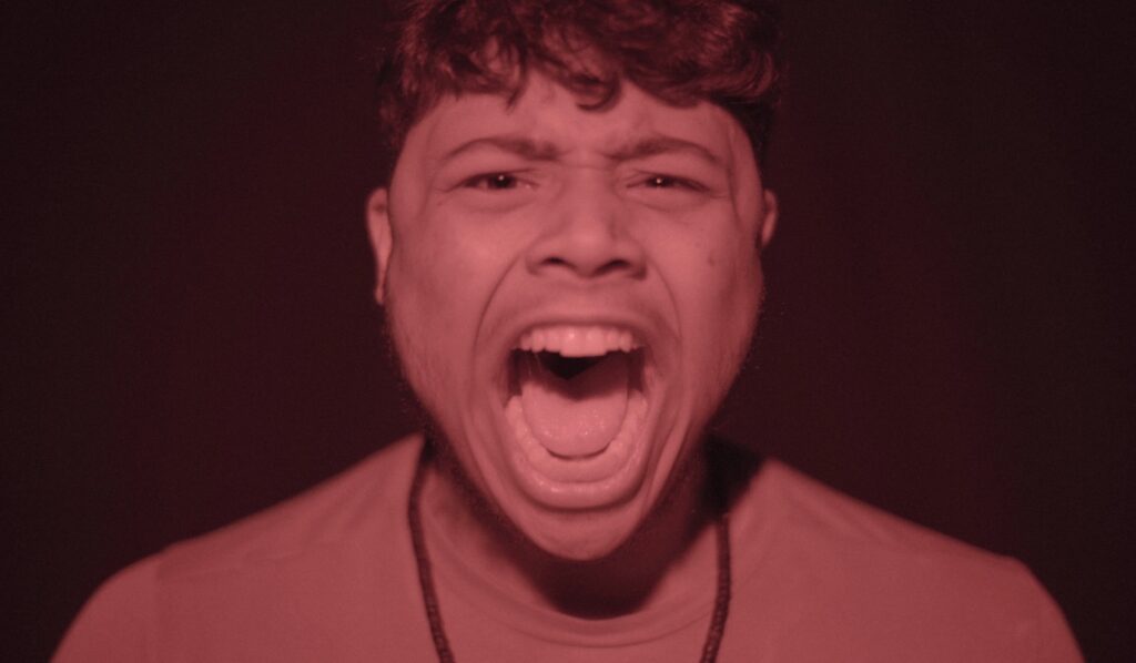 a man making a face with his mouth open