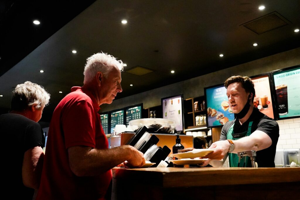 a man ordering food at a fast food restaurant