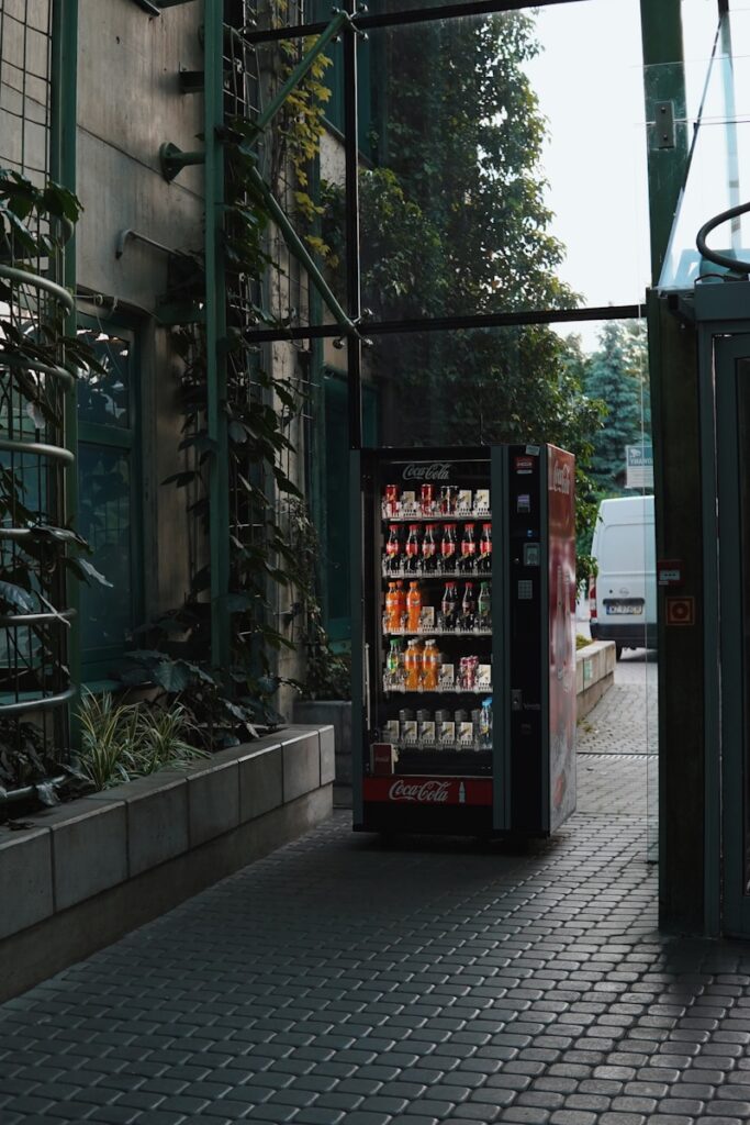 a vending machine sitting on the side of a road