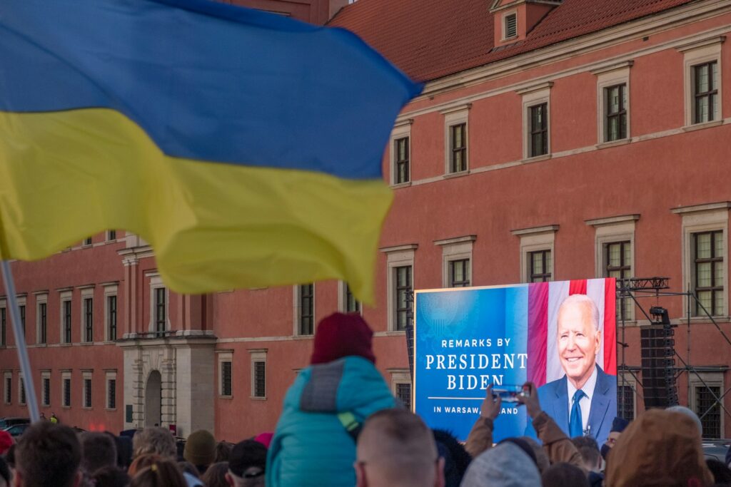 a crowd of people standing in front of a building