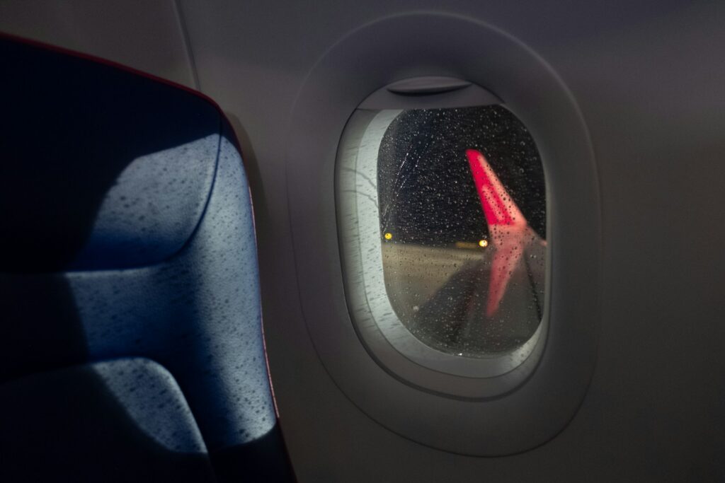 A view of the wing of an airplane through a window
