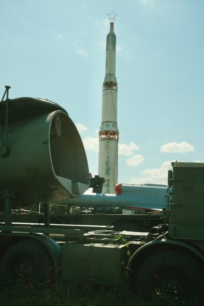 A truck with a rocket on the back of it