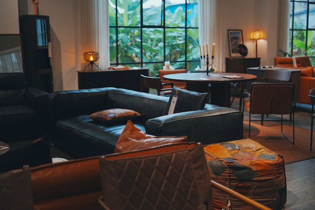a living room filled with furniture and lots of windows