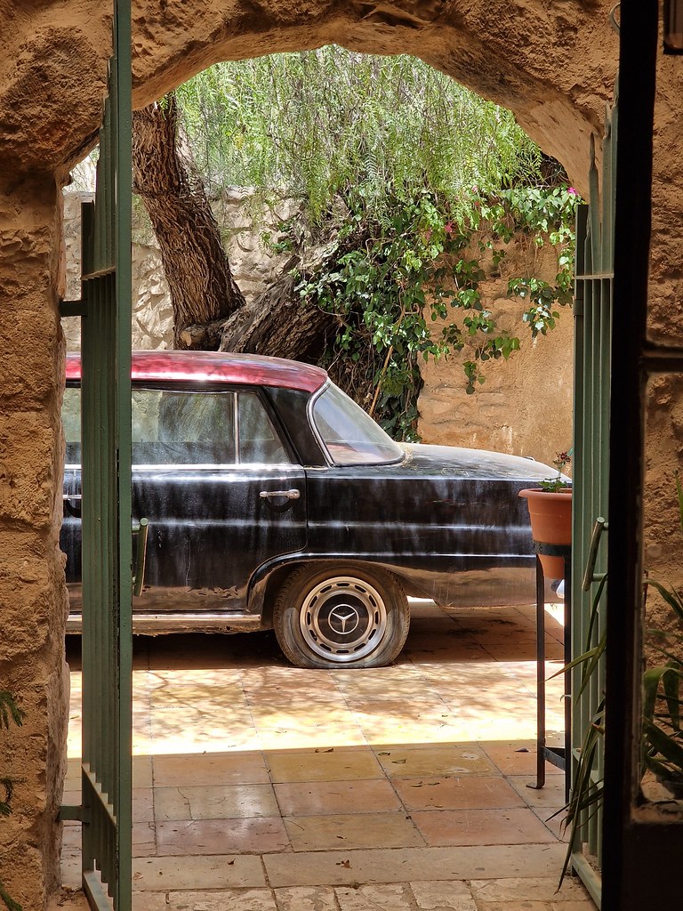 old Mercedes-Benz with flat tire
