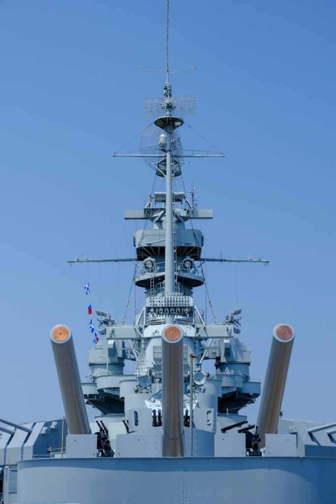 A large blue ship in the middle of a body of water