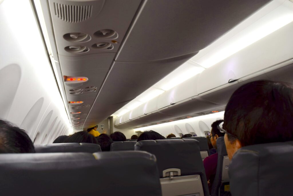 a group of people sitting on an airplane