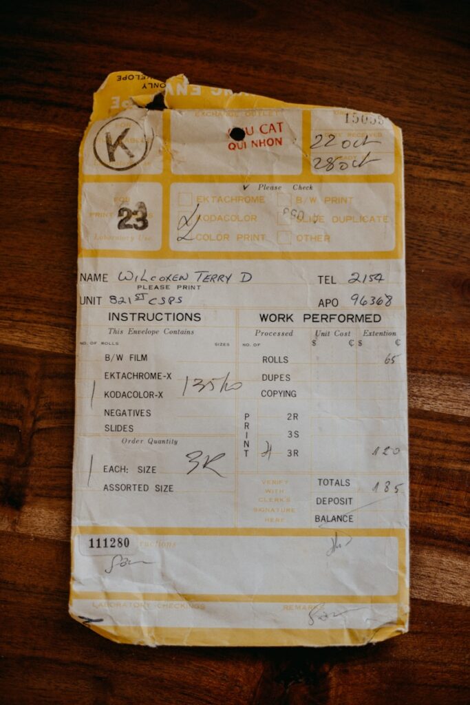 A receipt sitting on top of a wooden table