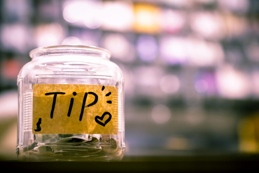 Beyond the Tip Jar: Unpacking the Racist Roots and Enduring Inequality of the Tipped Minimum Wage