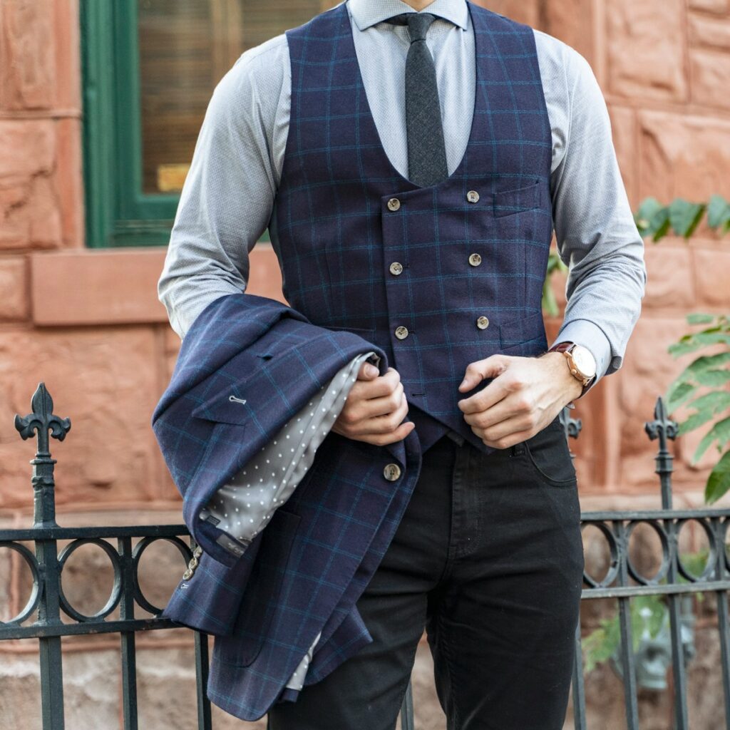 man in blue vest and blue dress shirt