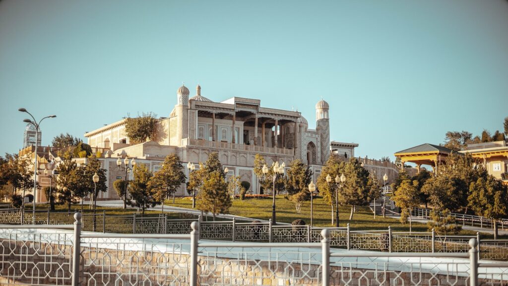a large building with a fence in front of it