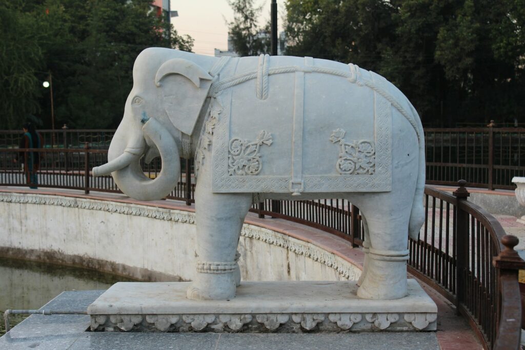 a statue of an elephant in a park