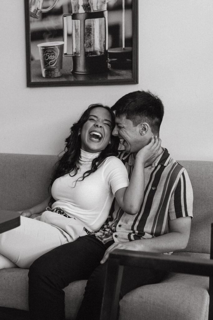 A man and a woman sitting on a couch