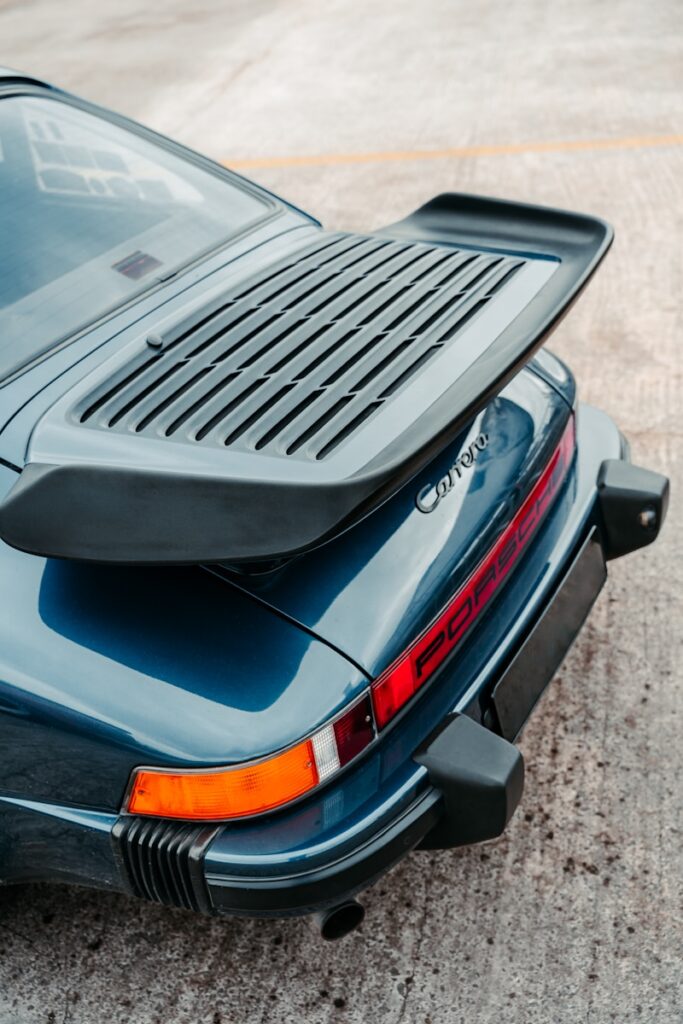 A black sports car parked on the side of the road