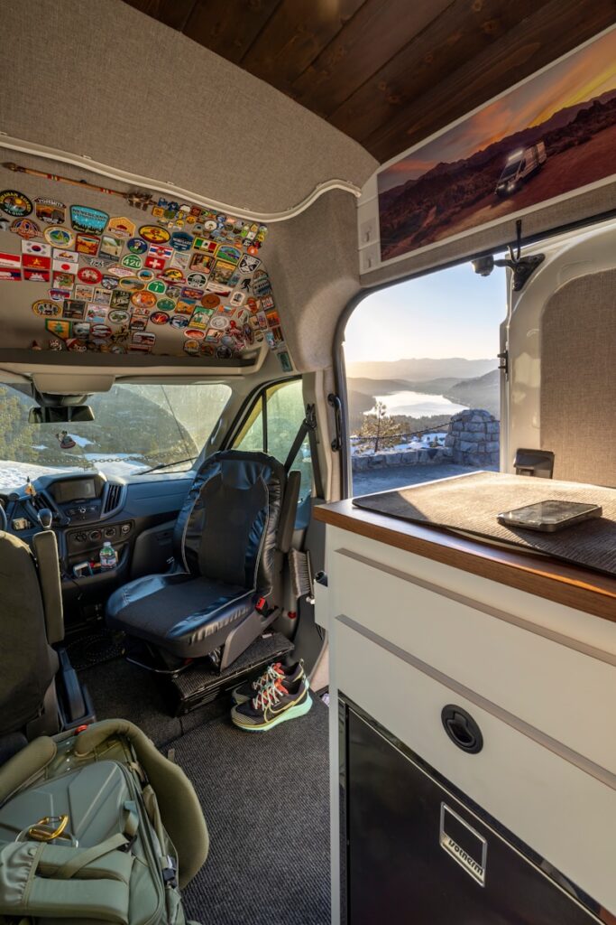 the interior of a camper van with a view of the mountains