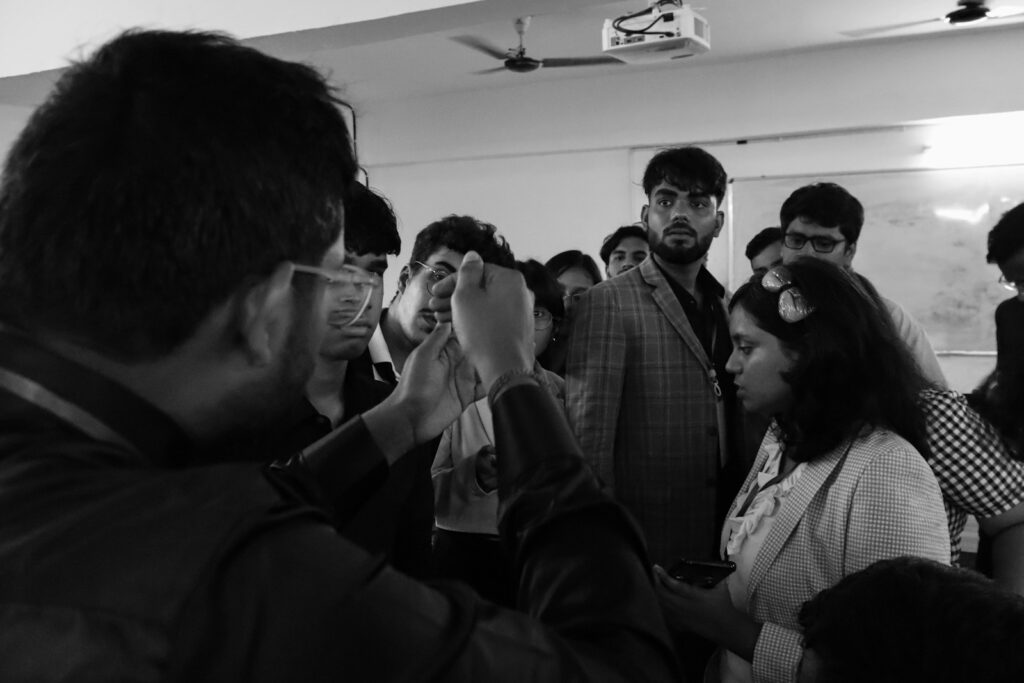 A group of people standing around each other